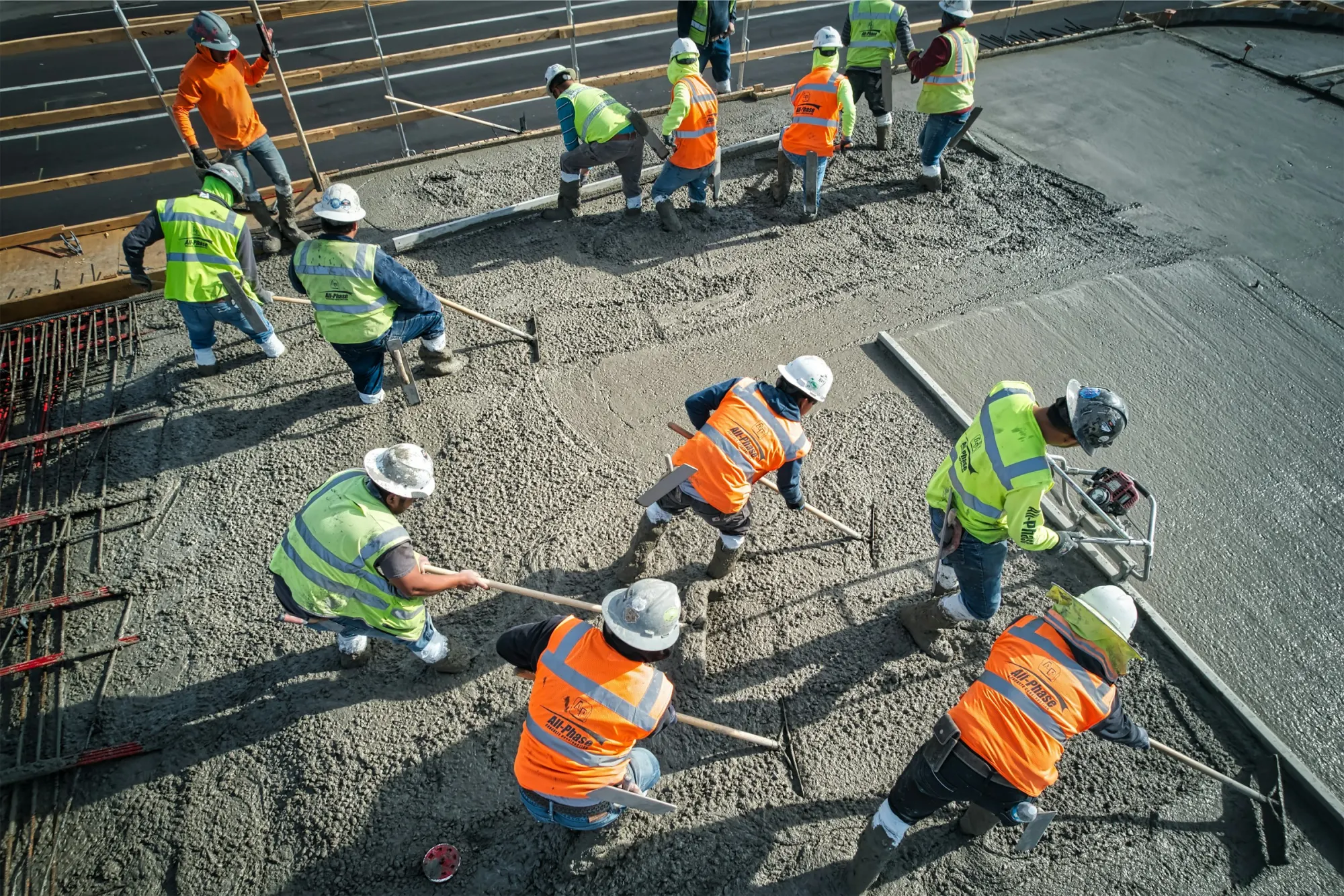 Construction crew placing concrete on an active civil project